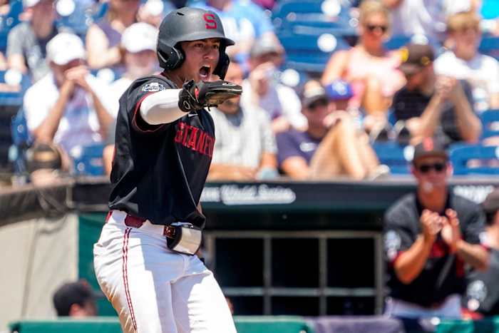 Stanford infielder Tommy Troy celebrates after scoring a run against Tennessee in the 2023 NCAA Men's College World Series.